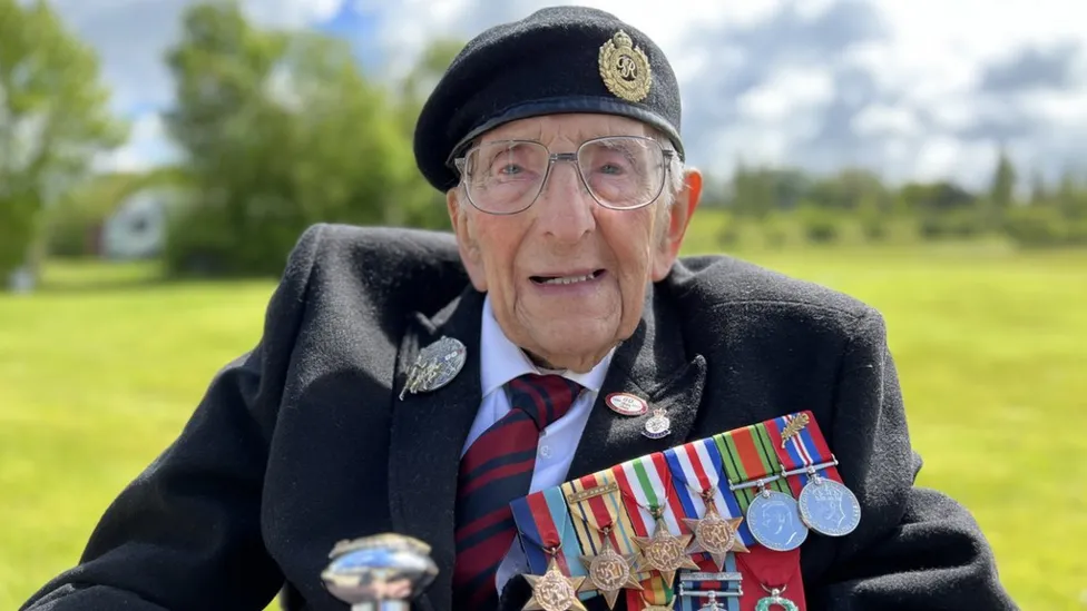 Don Sheppard, aged 103, smartly dressed and adorned with medals.