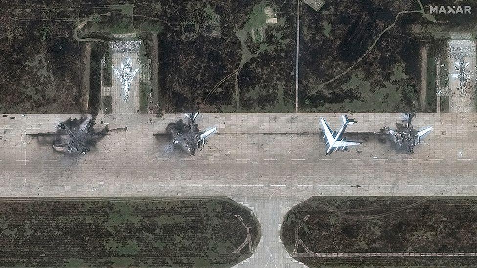 A satellite view shows four military aircraft, at least three looking destroyed, at the Belaya air base, near Stepnoy, Irkutsk region, Russia