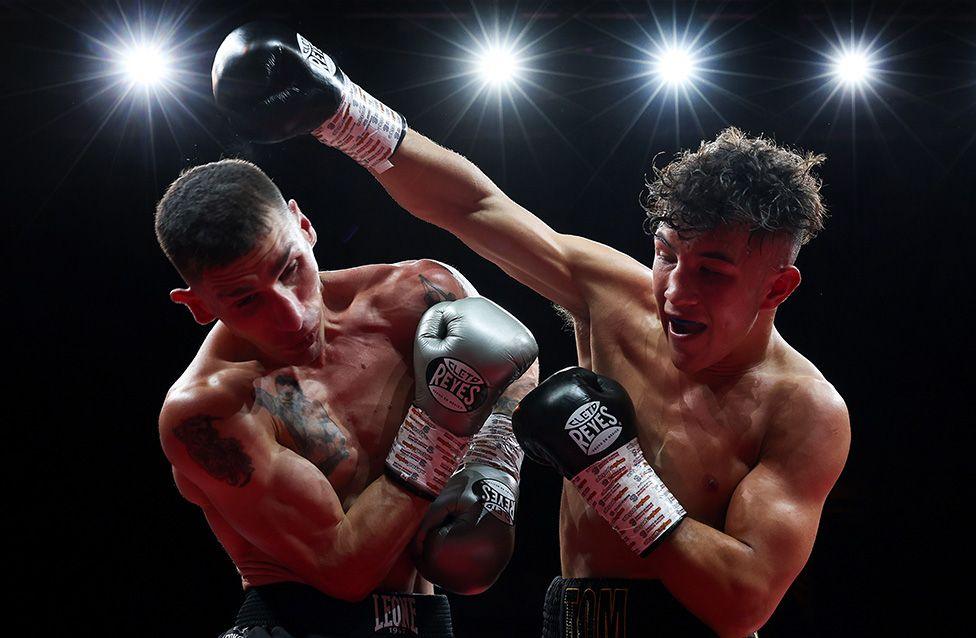 Tom Welland throws a punch against Reuquen Cona Facundo Arce during the Super Featherweight bout at the Utilita Arena in Newcastle. Photo by George Wood