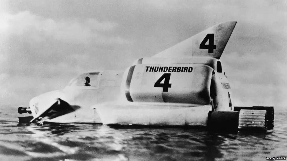 A black and white image of Thunderbird 4 on water