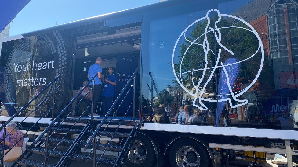 People visiting the Your Heart Matters truck at Clock Tower in Leicester.