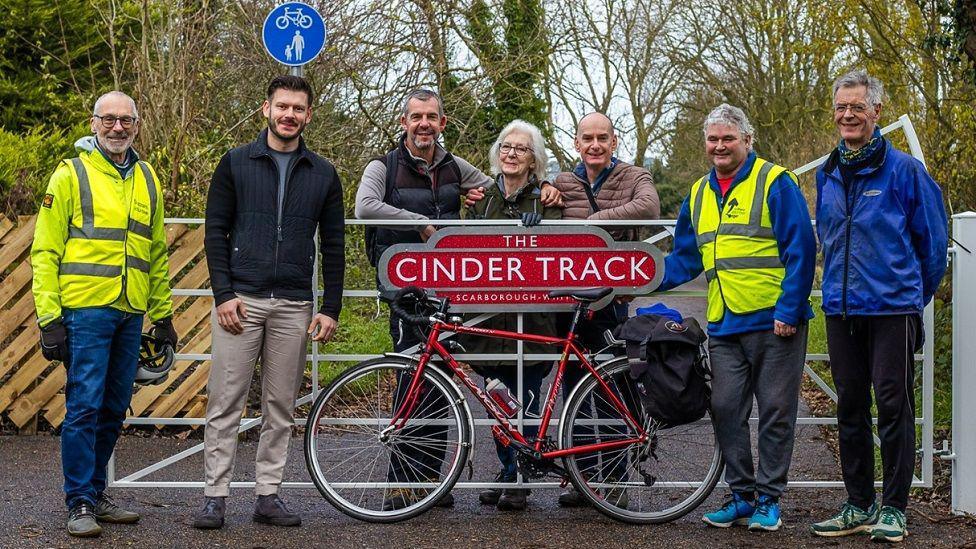 Councillor Keane Duncan (second left), with residents and volunteers from Sustrans on the upgraded Cinder Track