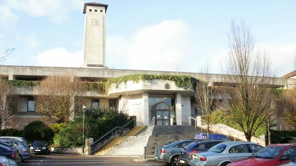 Newport Crown Court, with cars parked at the foot of the steps leading to the main entrance