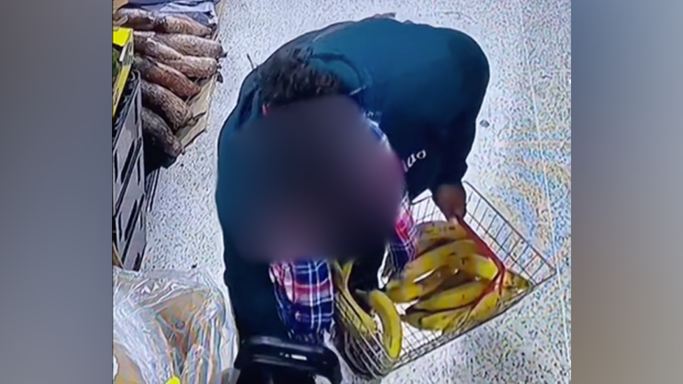 CCTV of a woman with a basket