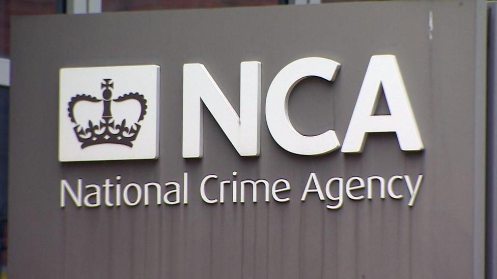 The National Crime Agency headquarters building sign.