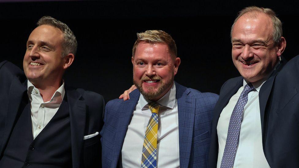 Alex Cole-Hamilton, Jamie Green and Sir Ed Davey in suits at the Scottish Liberal Democrat conference.