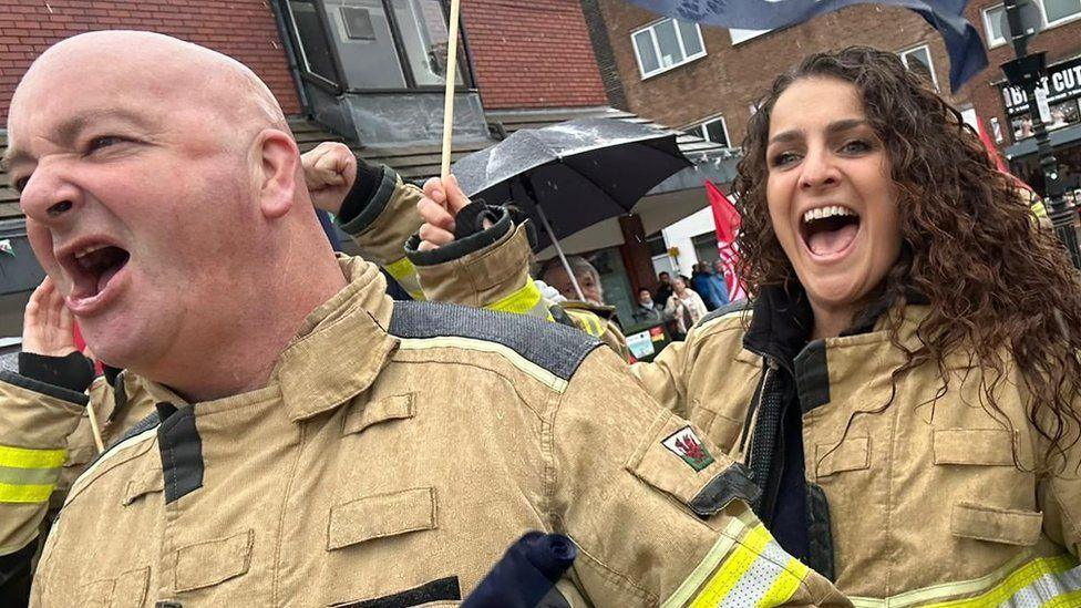 Firefighters chanting on a protest