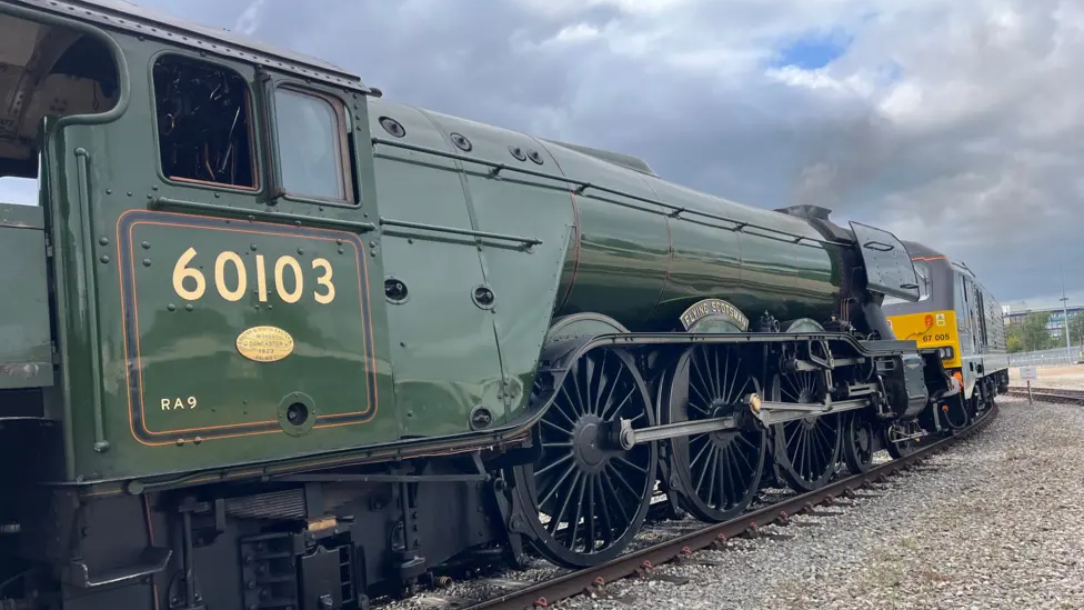 The Flying Scotsman is pictured on train tracks