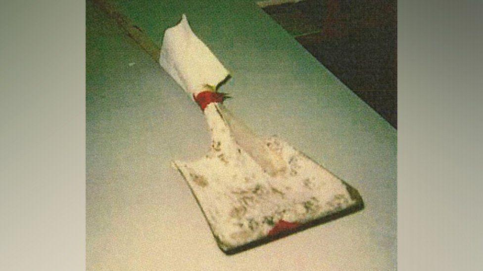 Police photo of the shovel that Mark Gordon hit Patrick Nash with