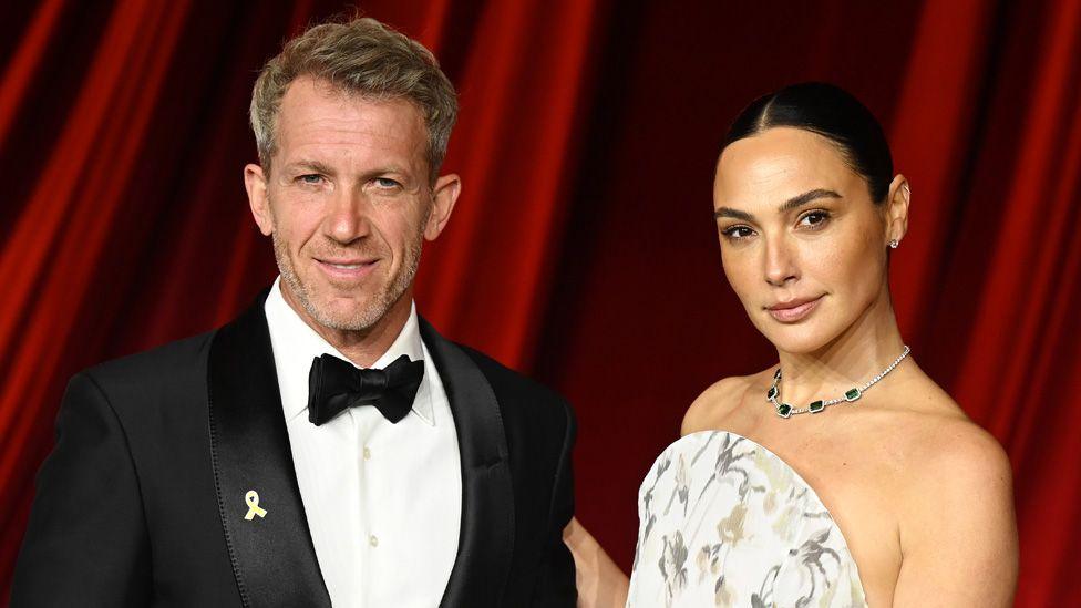 Gadot with Jaron Varsano in formal dress at the Fourth Annual Academy Museum Gala at Academy Museum of Motion Pictures on October 19, 2024 in Los Angeles