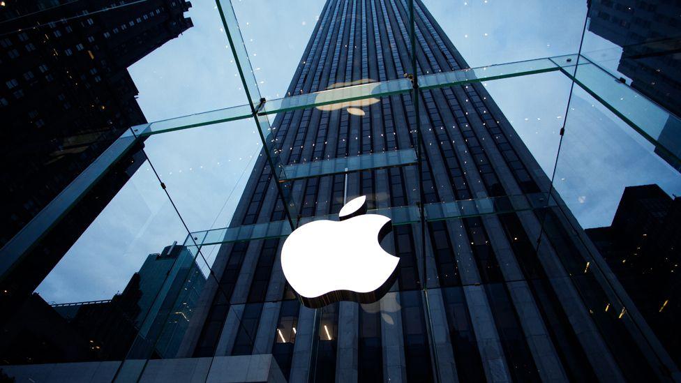 Apple's logo shown on its glass store front in New York.