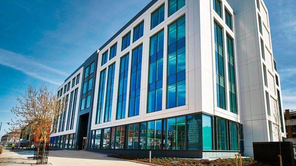 Slough Borough Council's headquarters, a large modern building predominantly fronted with glazing and white walls.