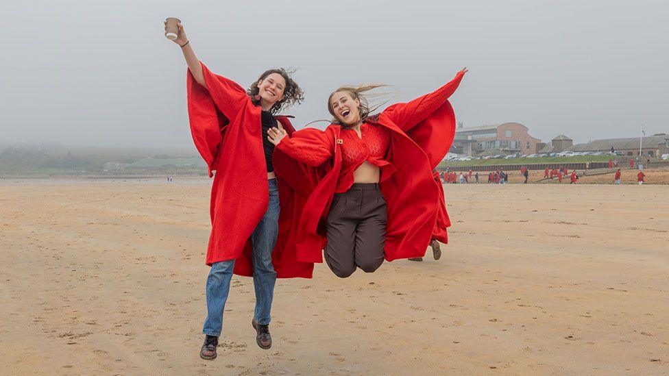 Undergraduates at the University of St Andrews take part in the traditional Pier Walk before the start of the new academic year.