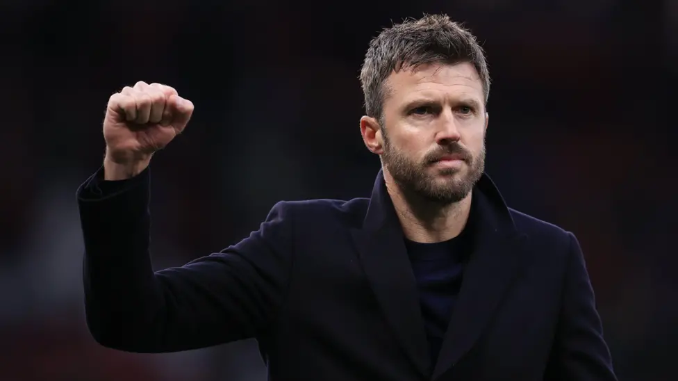 Manchester United interim boss Michael Carrick raises his fist in celebration after a Premier League win over Fulham