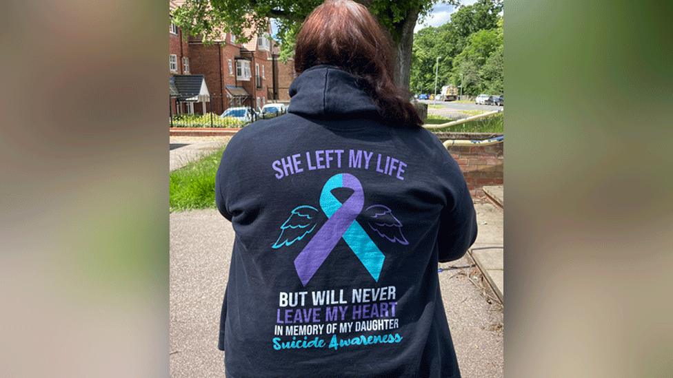 Back of woman wearing a hoodie