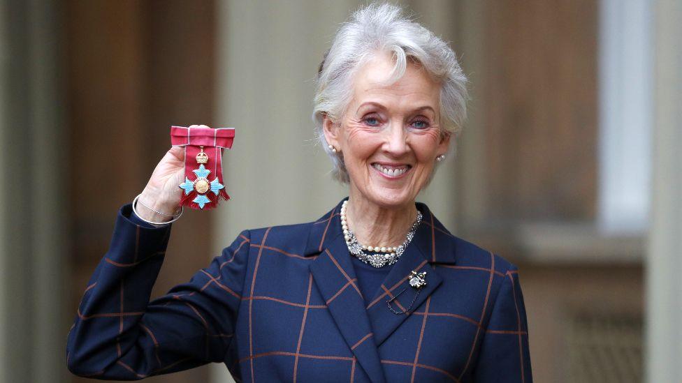 British author Joanna Trollope poses with her medal after she was made a Commander of the Order of the British Empire (CBE) for services to literature during an investiture ceremony at Buckingham Palace, London on December 19, 2019