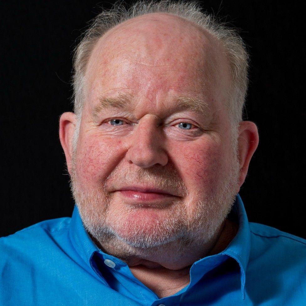 Graham Matthews, 70, in portrait, looking directly at the camera