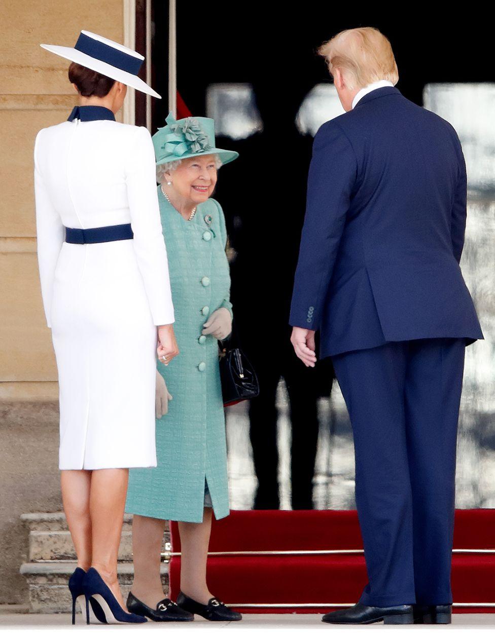 Queen Elizabeth II greets Melania Trump and US President Donald Trump as they attend their ceremonial welcome in the Buckingham Palace garden on day one of his state visit to the UK on June 3, 2019 in London, England.  