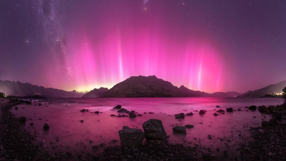 The Aurora Australis captured above the mountains in Queenstown