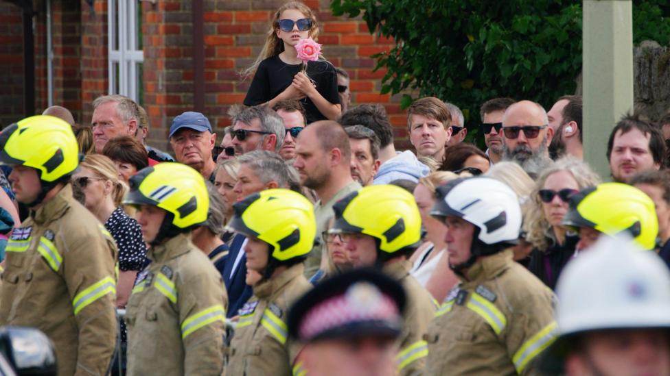 Thousands turn out for Bicester firefighter's funeral procession - BBC News