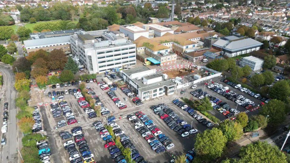Aerial shot of Worthing Hospital complex and its car park