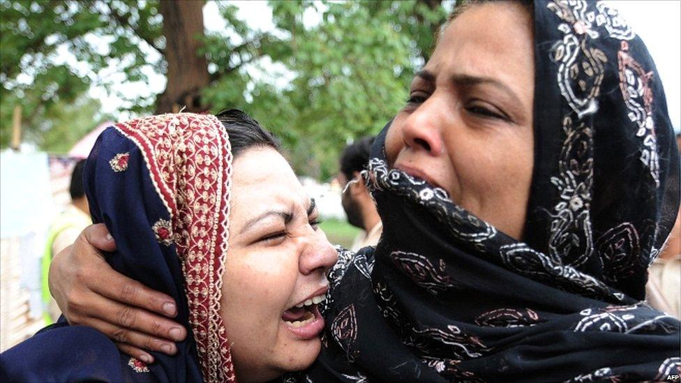Pakistani women cry in Islamabad