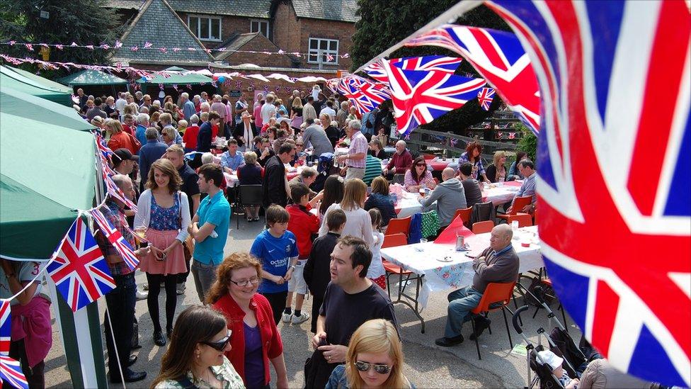 Crowd gather at the Four Bells Inn at Woodborough, Nottinghamshire , to celebrate the royal wedding