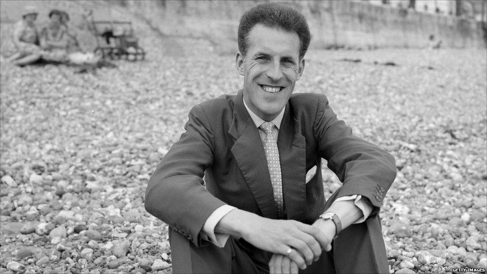 Bruce Forsyth on a beach in 1958