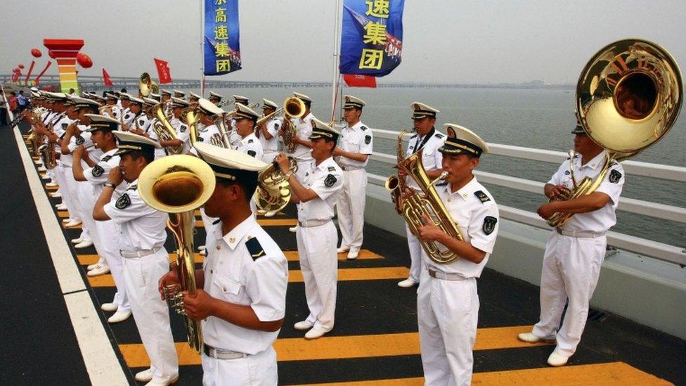 Band play on Jiaozhou Bay Bridge in Qingdao, China