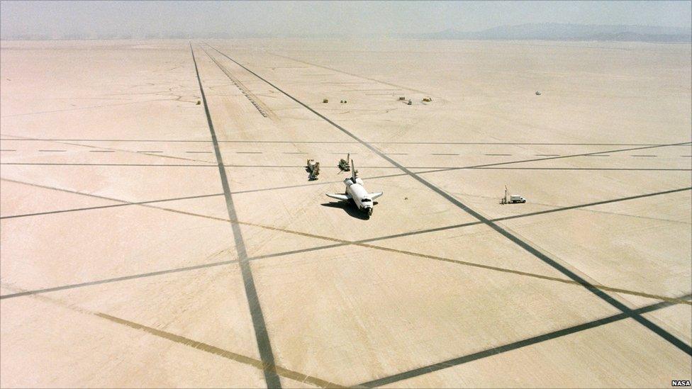 Space Shuttle Columbia rests on Rogers Dry lake bed at Edwards Air Force Base, California, after landing and completing its first orbital mission