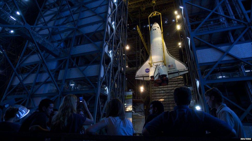 The space shuttle Atlantis STS-135 is hoisted to the high bay for mating to the external tank and solid rocket boosters inside the vehicle assembly building at the Kennedy Space Center, 18 May 2011.