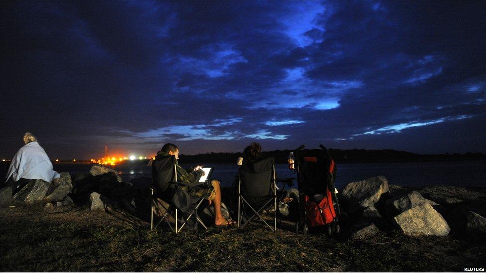 Spectators camp out early Friday morning