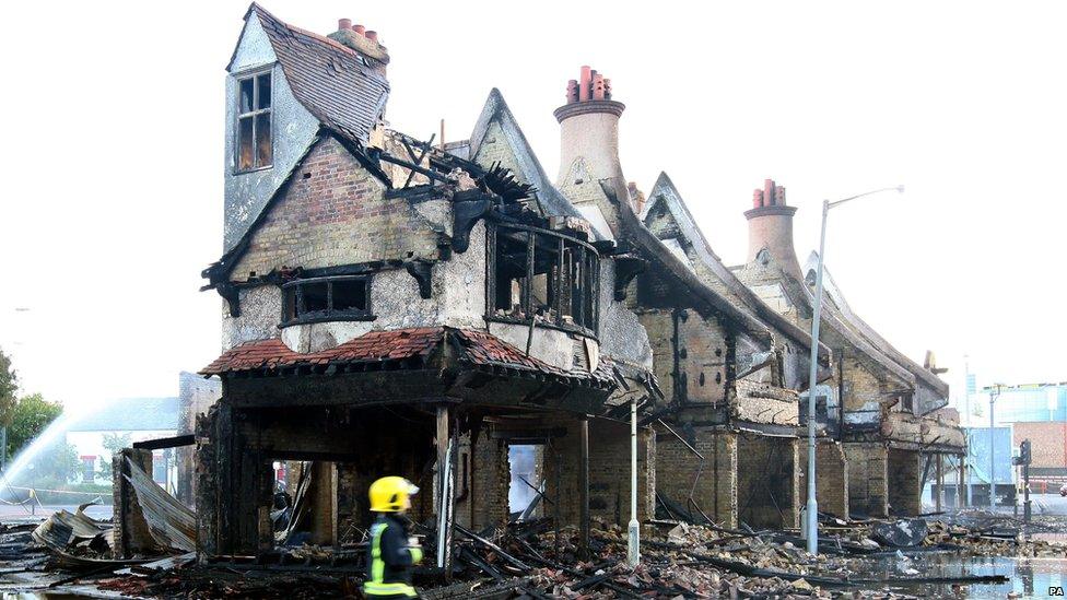 The burnt out shell of a furniture store in Croydon, south London