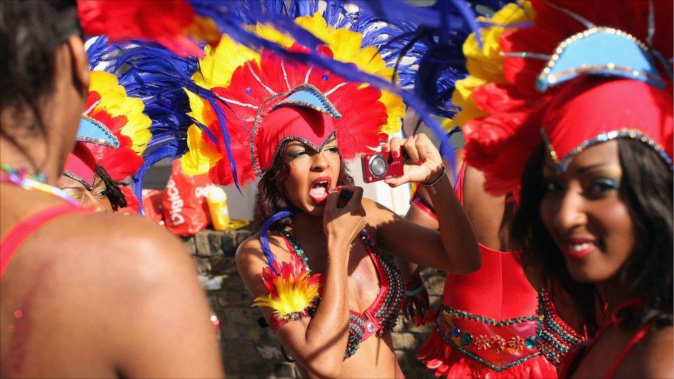 Performers prepare to take part in the Notting Hill Carnival