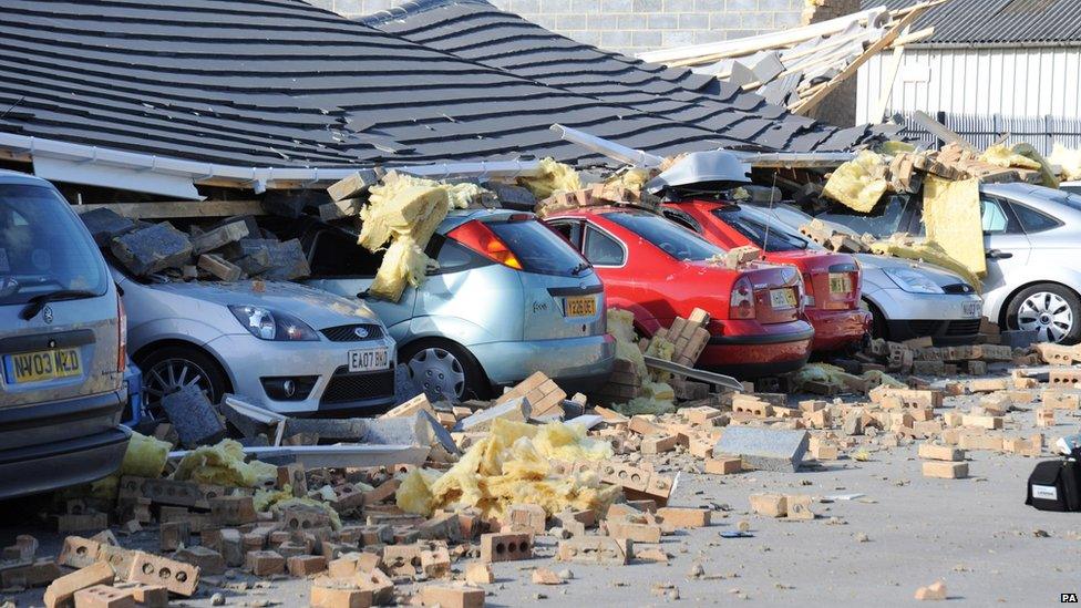 Cars outside a bakery in County Durham were crushed when a roof collapsed in high winds.