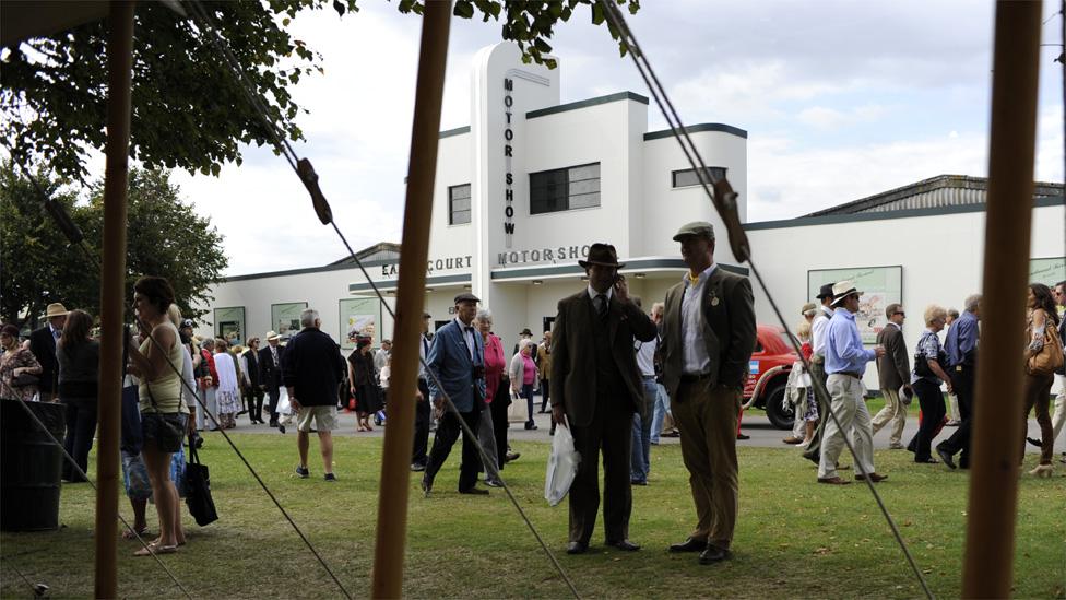 People gather at the exhibition area at Goodwood