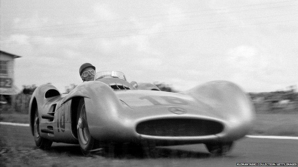 Fangio is at the wheel of his Mercedes-Benz W196 Streamliner at the the French Grand Prix in Reims.