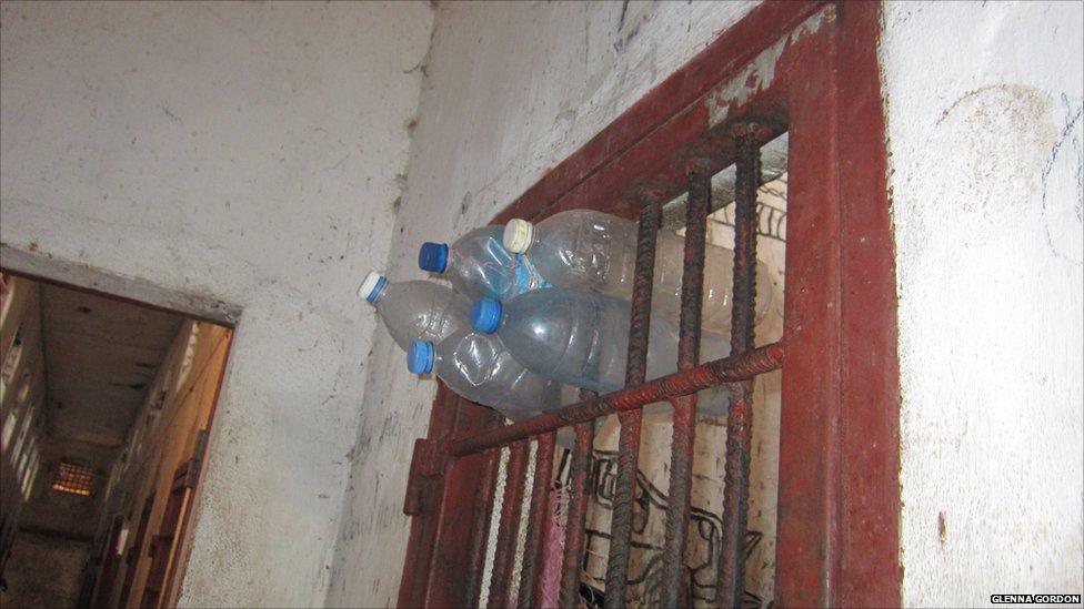 Plastic bottles sticking out of bars in Liberia's Monrovia Central Prison - 2011