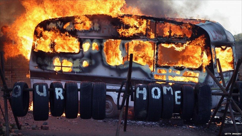 Flames engulf a caravan during evictions from Dale Farm travellers camp on 19 October, 2011