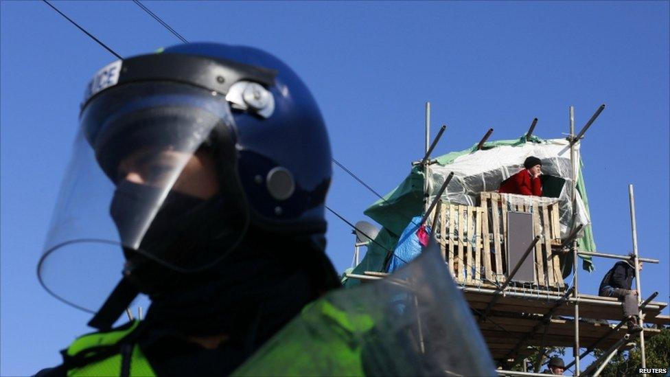 A police officer stands near a tower made of scaffolding at the Dale Farm Traveller site near Basildon, Essex, on 19 October, 2011