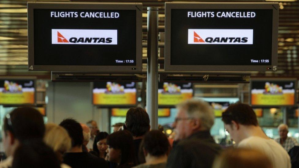 Stranded Qantas passengers at Singapore’s Changi Airport October 29, 2011