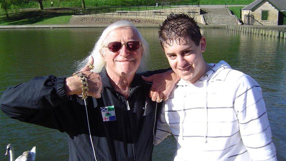 Jimmy Savile pictured with Elliot Bransby