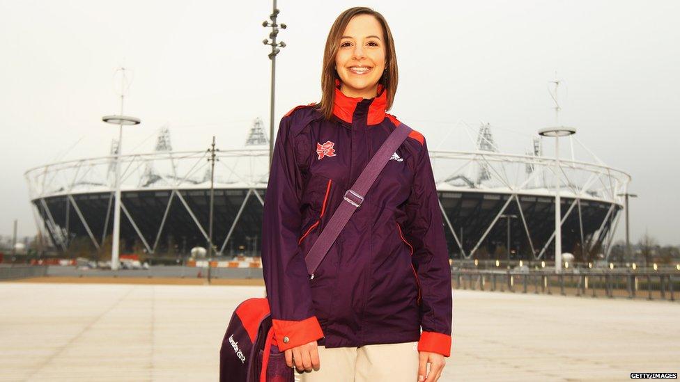 Helen, a Games Maker volunteer, models the new uniform outside the Stratford Olympic Stadium.