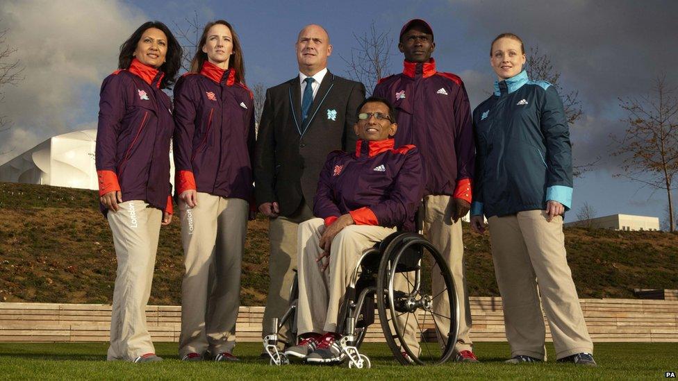 The Games Maker's and technical volunteers model their new uniforms for the London Olympics.