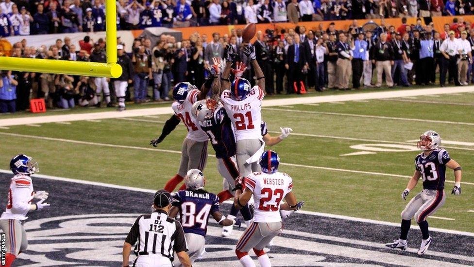 Aaron Hernandez of the New England Patriots is unable to catch the last play of the Super Bowl