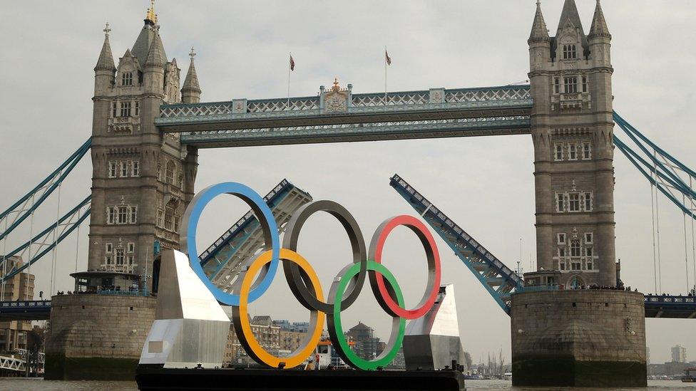 Tower Bridge raised to allow the Olympic rings through.