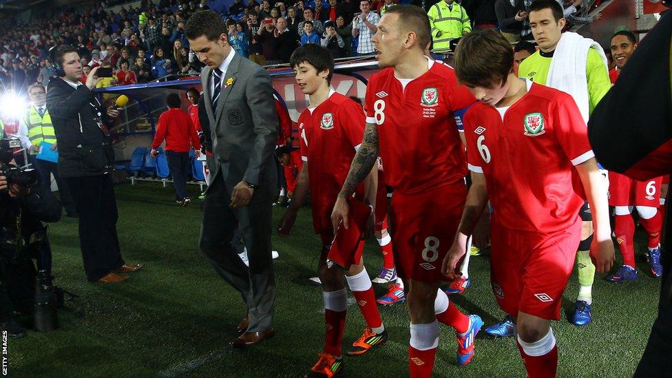 Gary Speed's sons Ed and Tom led the Wales team out against Costa Rica in Cardiff with family friend and captain for the night Craig Bellamy and regular skipper Aaron Ramsey, who is injured