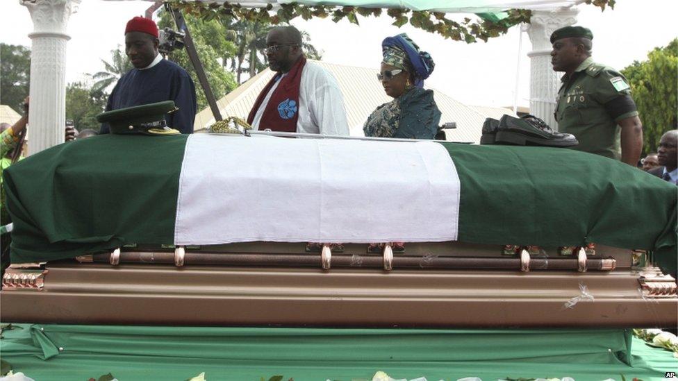 Nigeria President Goodluck Jonathan, left, his wife Patience Jonathan, second right, and Emeka Ojukwu, the son of the deceased, second left, attend the funeral of Chukwuemeka Ojukwu