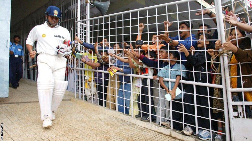 Sachin Tendulkar walks out to bat