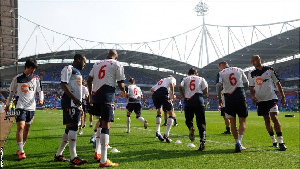 The Bolton players warm up at the Reebok Stadium